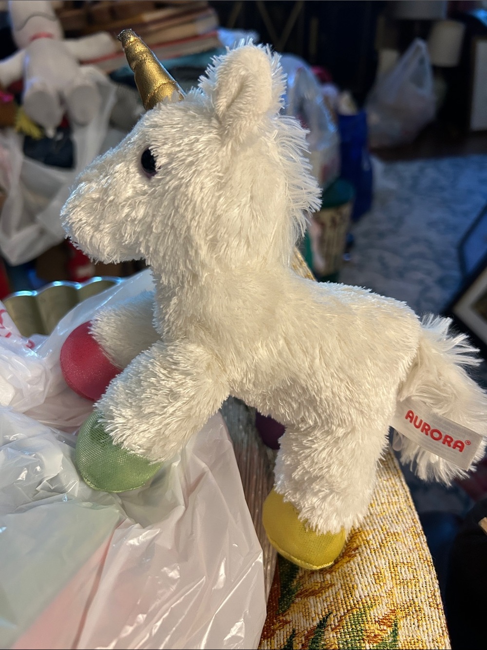 Aurora 10” White Unicorn Plush Toy with Gold Horn and multicolored hoofs. New-